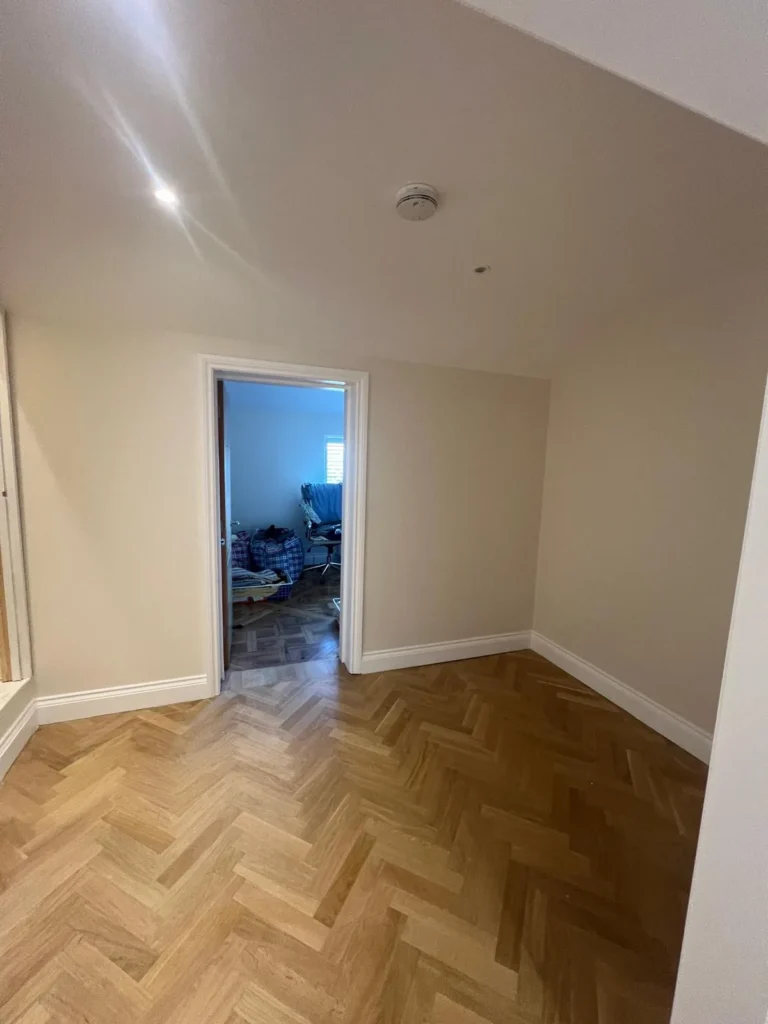 Herringbone parquet flooring in a freshly decorated hallway